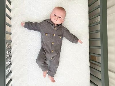 Jack Jordan Rodgers is lying on his bed.